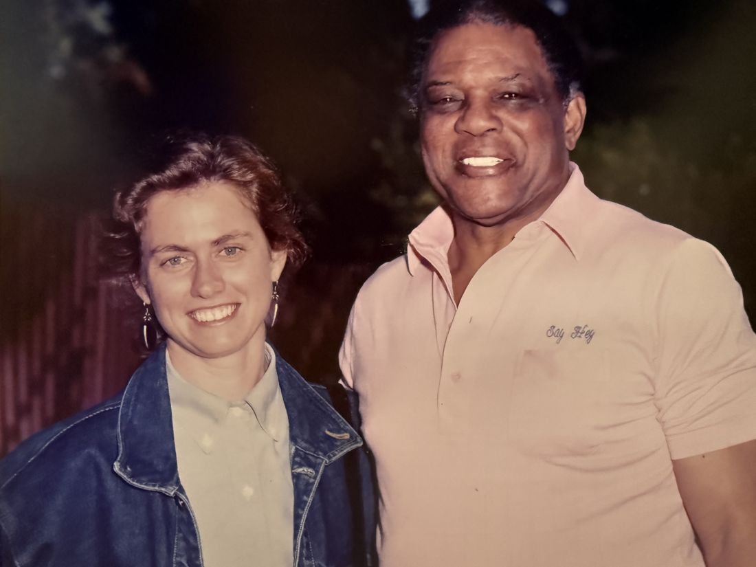 Fenzi's Director of Design smiling beside Willie Mays, who wears a pink polo embroidered with Say Hey
